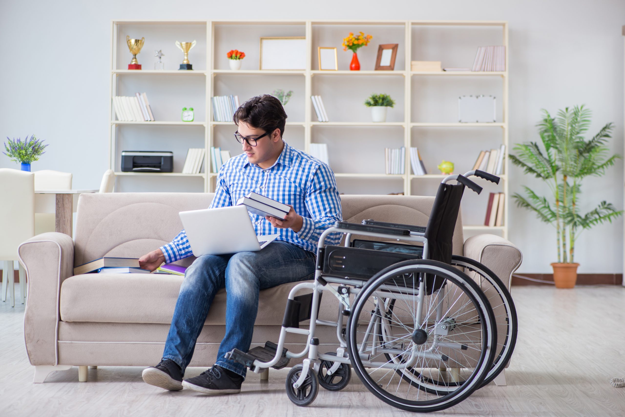 Young student on wheelchair in disability concept